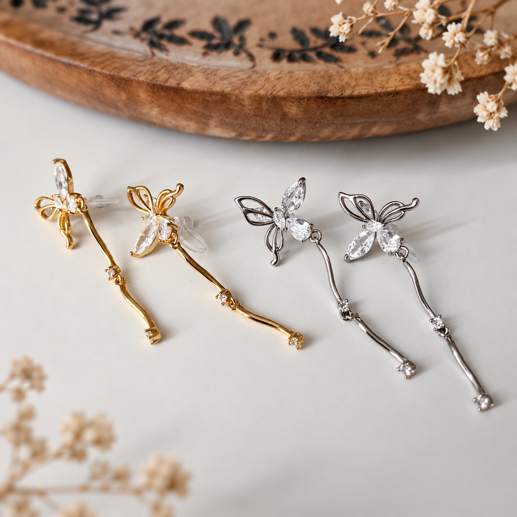 Clips d’oreilles papillon pendantes avec chaîne