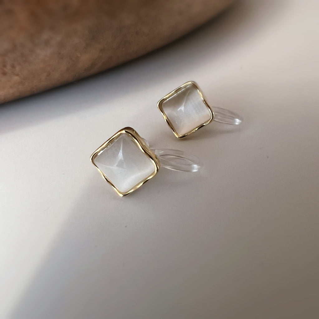 Clips d’oreilles œil de chat blanc crème