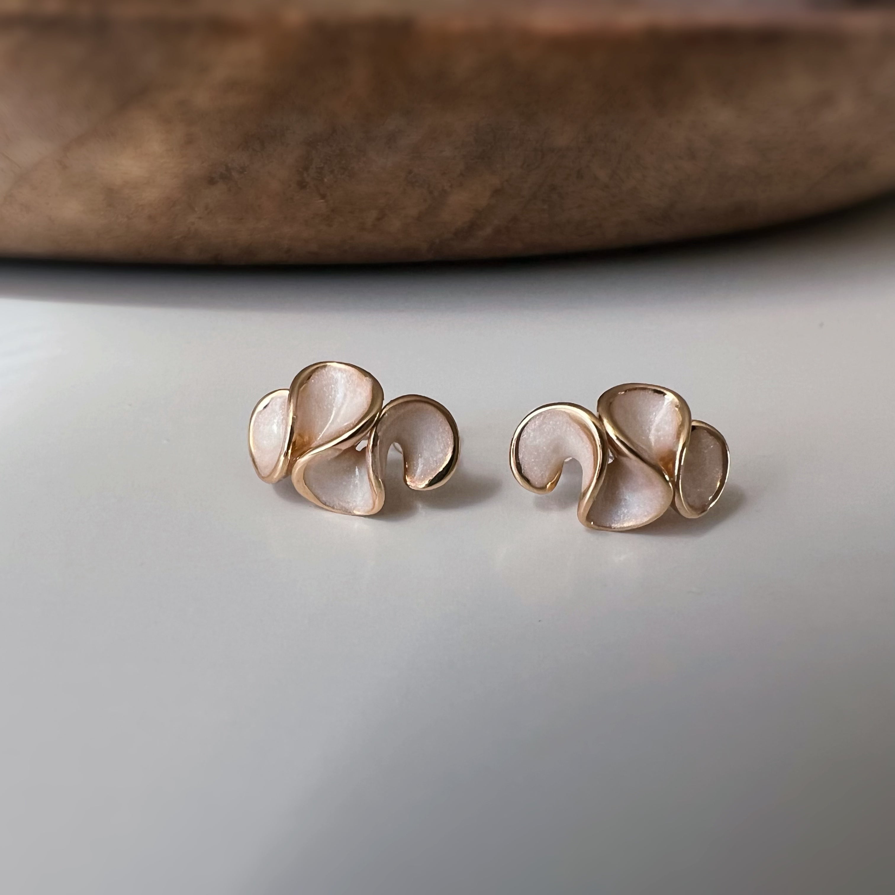 Pretty petal clip-on earrings with cream enamel finish