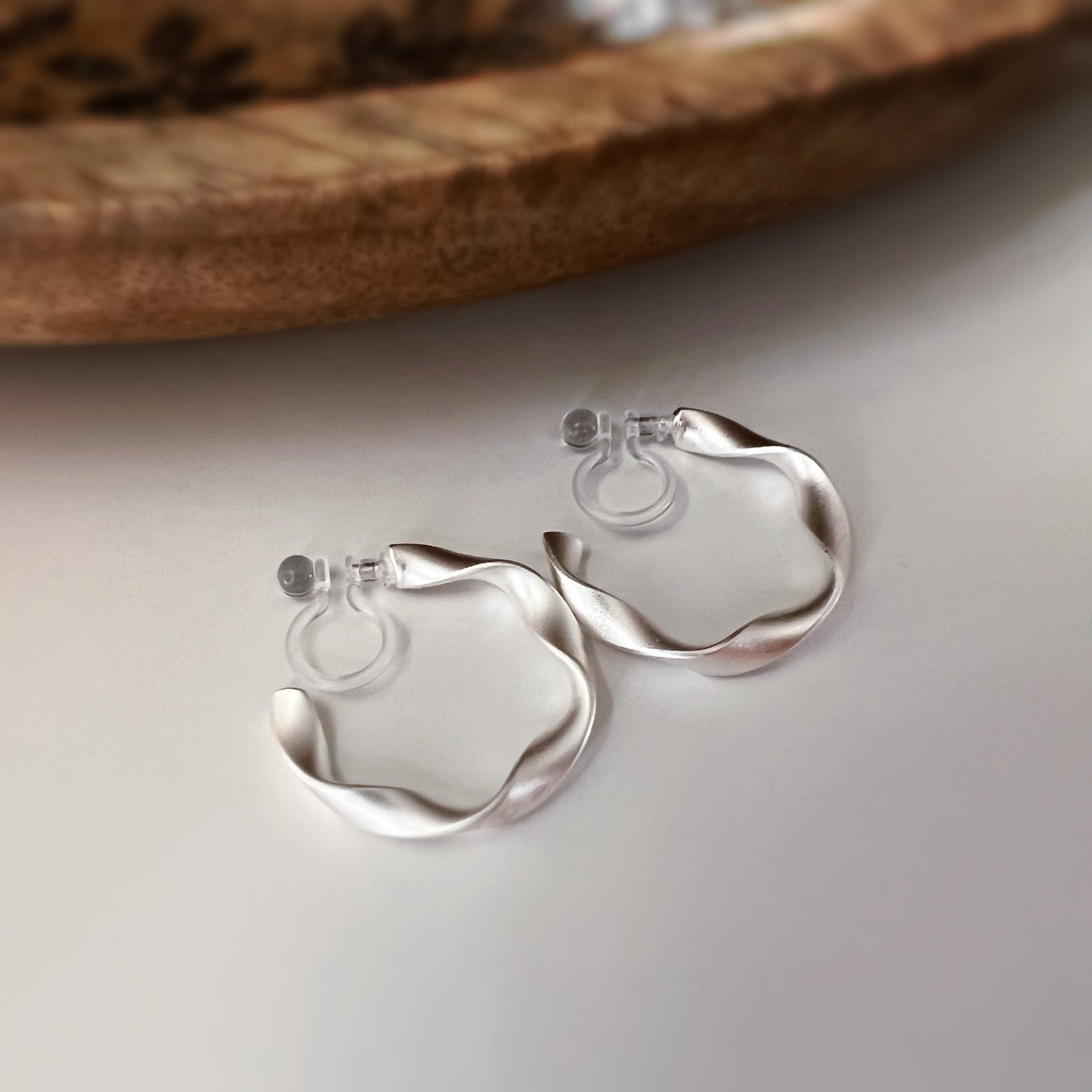 Silver / gold twisted hoop clip-on earrings