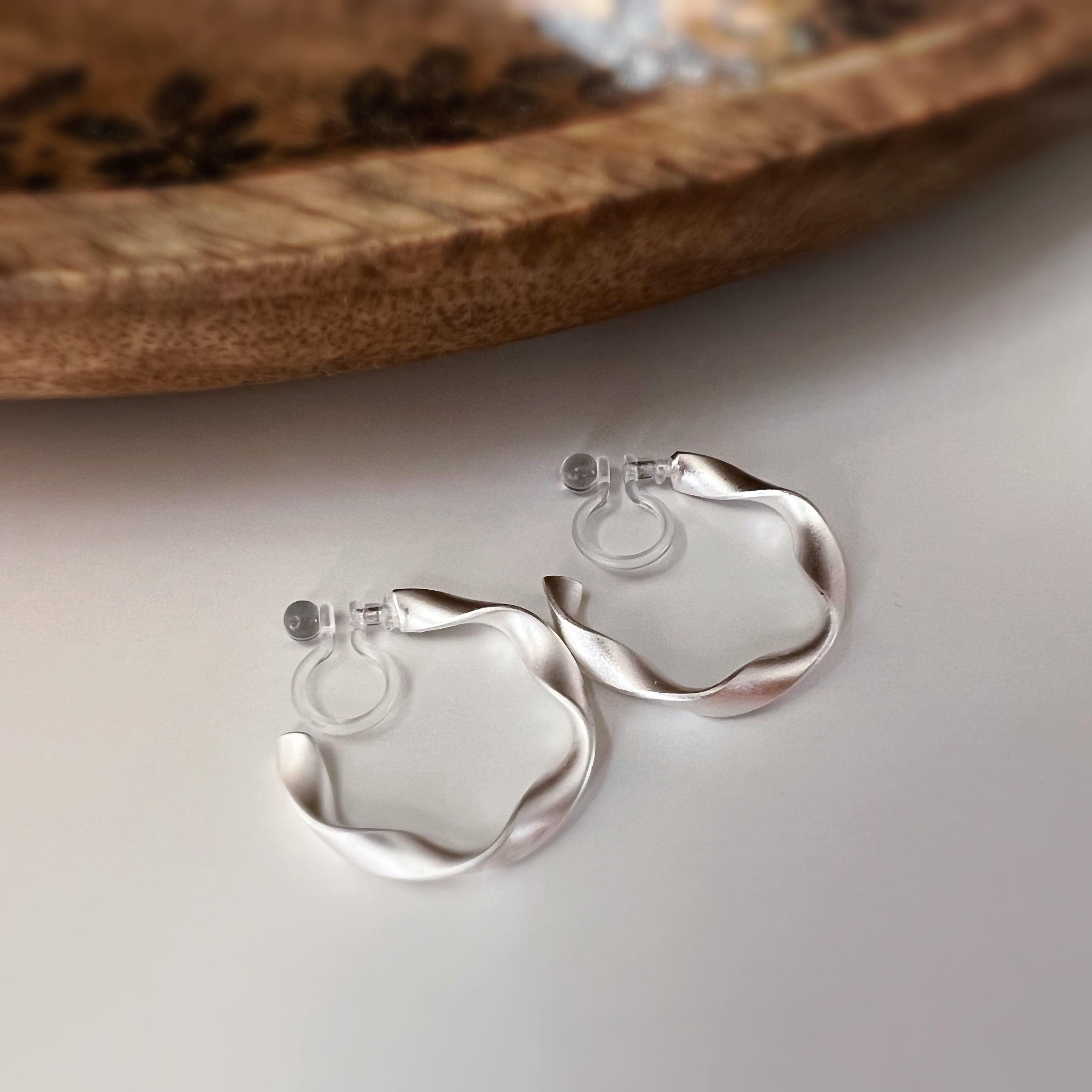 Silver / gold twisted hoop clip-on earrings