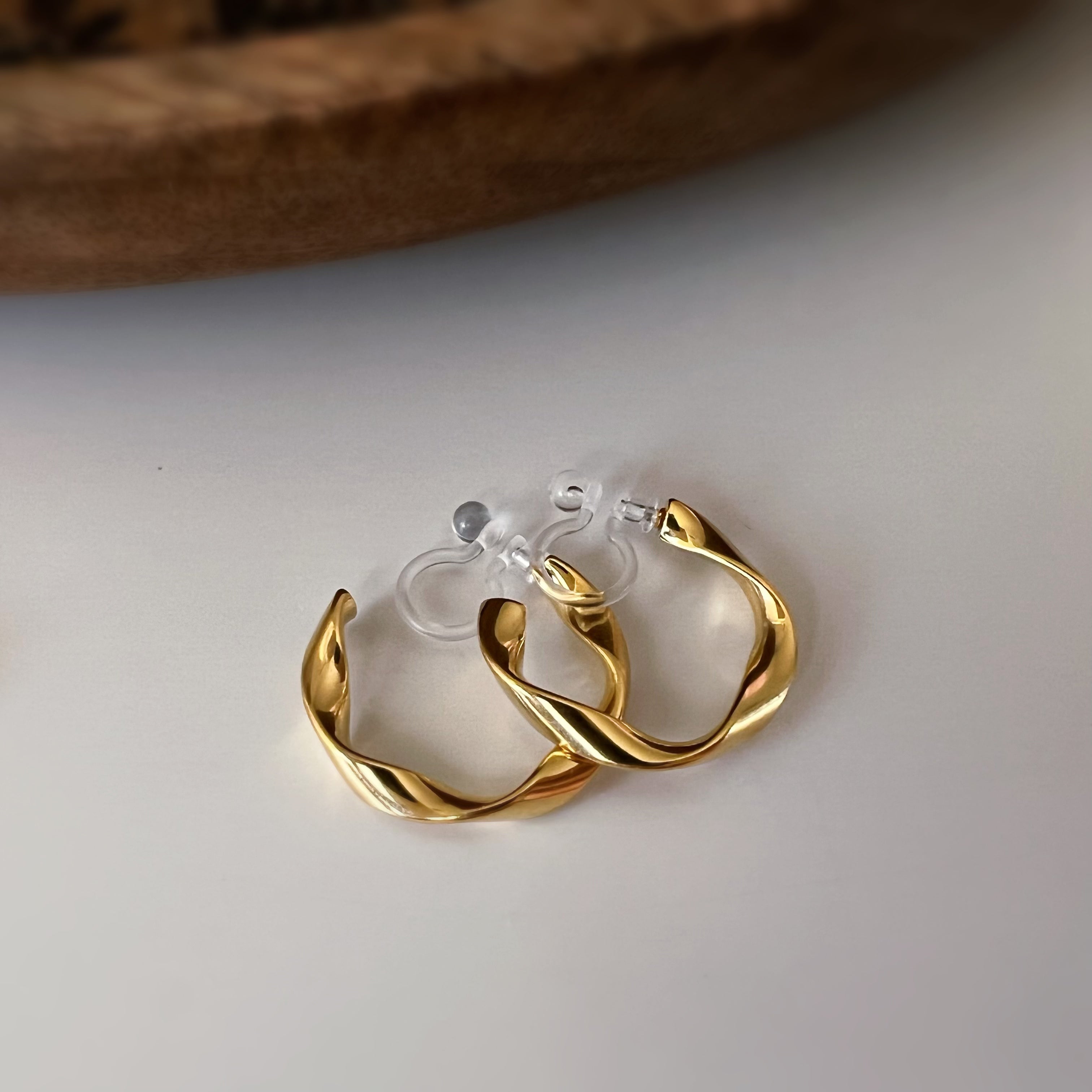 Silver / gold twisted hoop clip-on earrings
