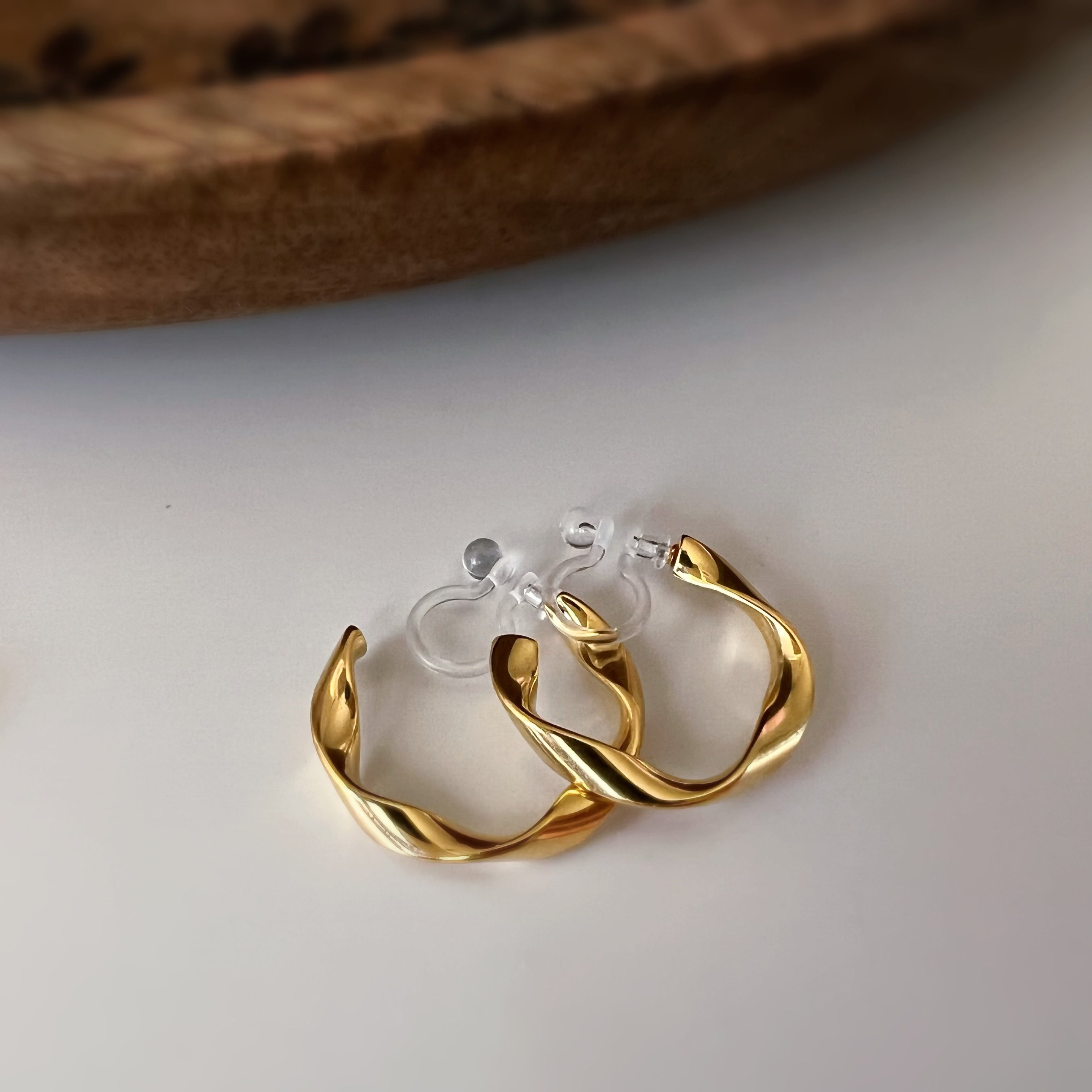 Silver / gold twisted hoop clip-on earrings