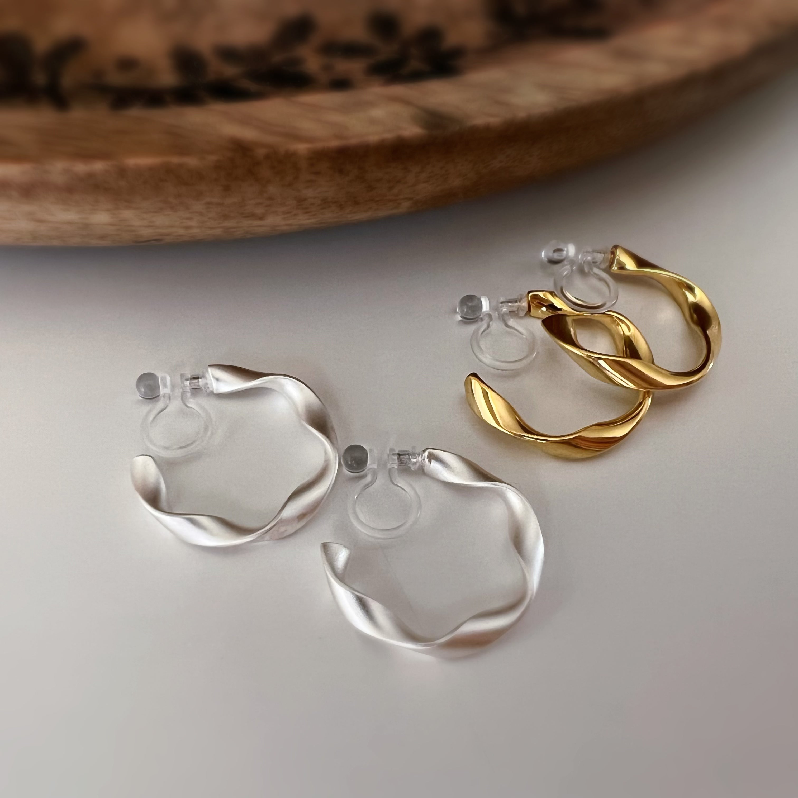 Silver / gold twisted hoop clip-on earrings