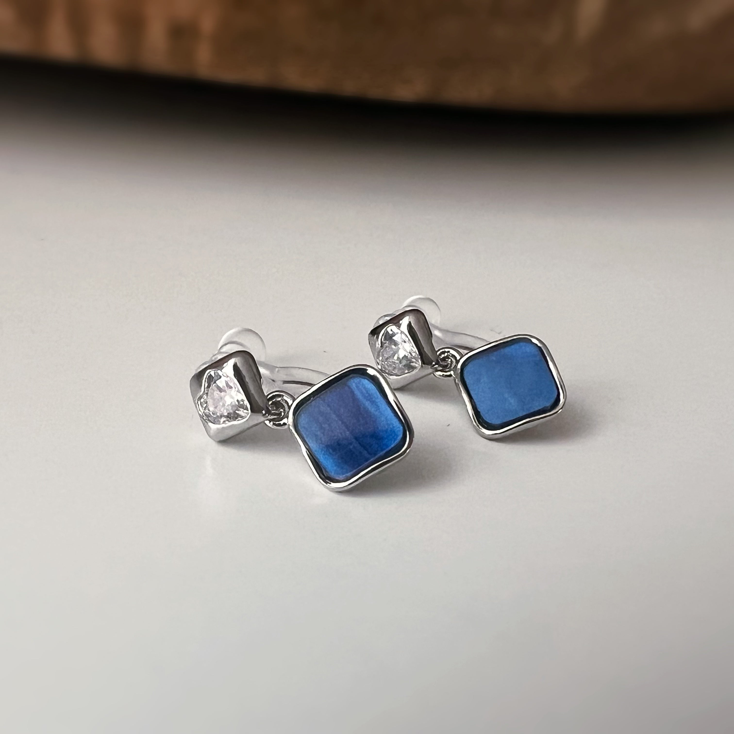 Square enameled clip-on earrings in silver, mother-of-pearl blue, black, or white