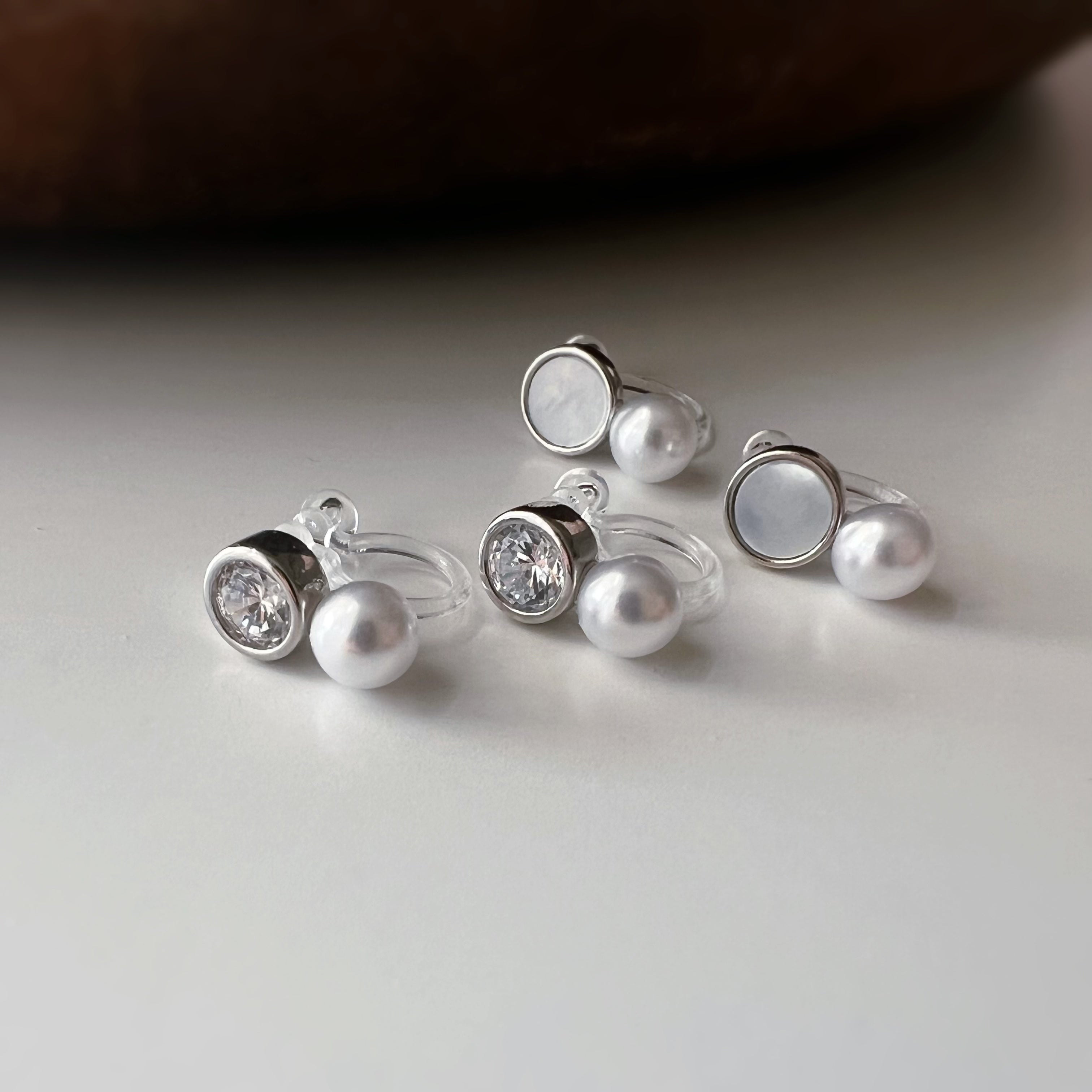 Mini white mother-of-pearl rhinestone pearl ear clips