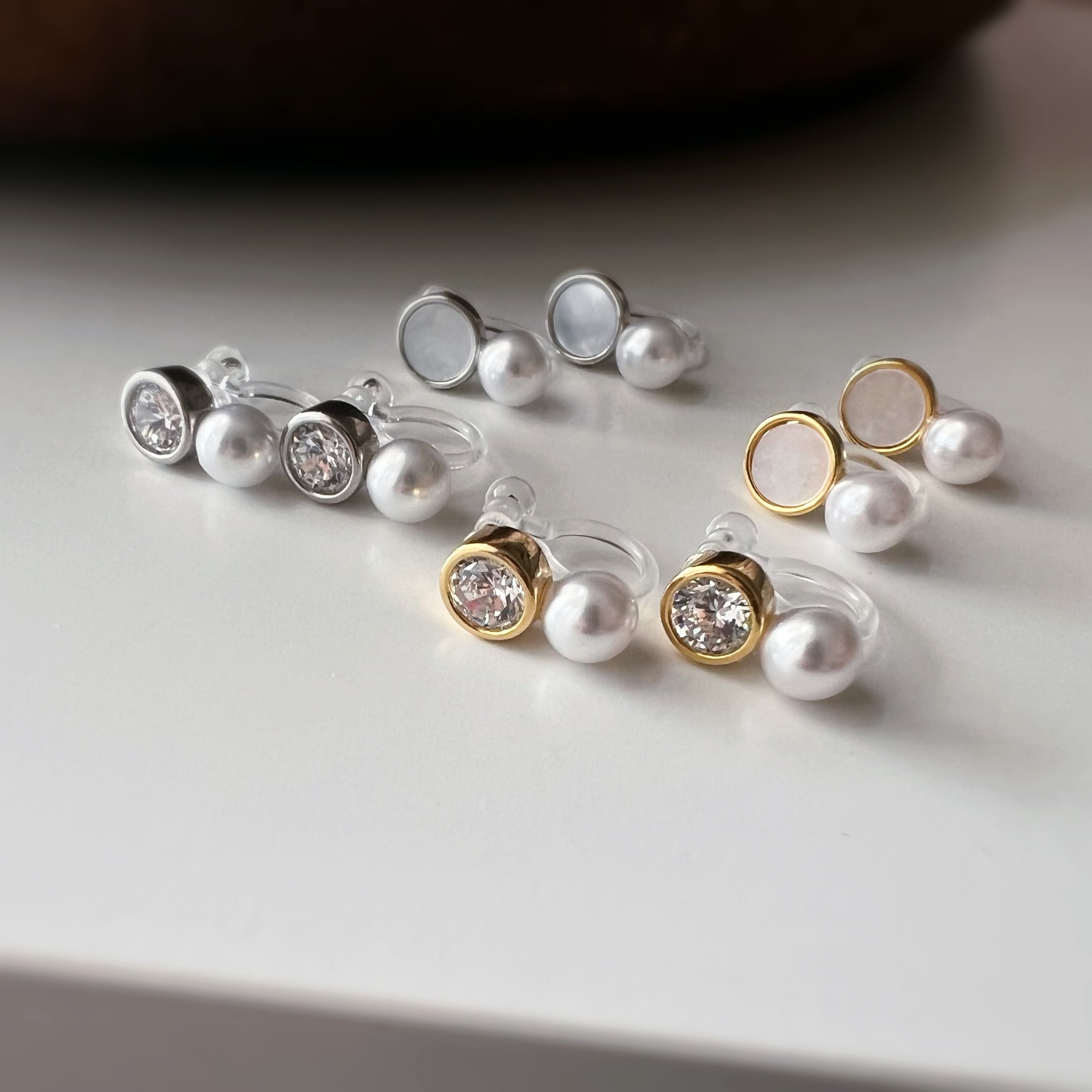 Mini white mother-of-pearl rhinestone pearl ear clips