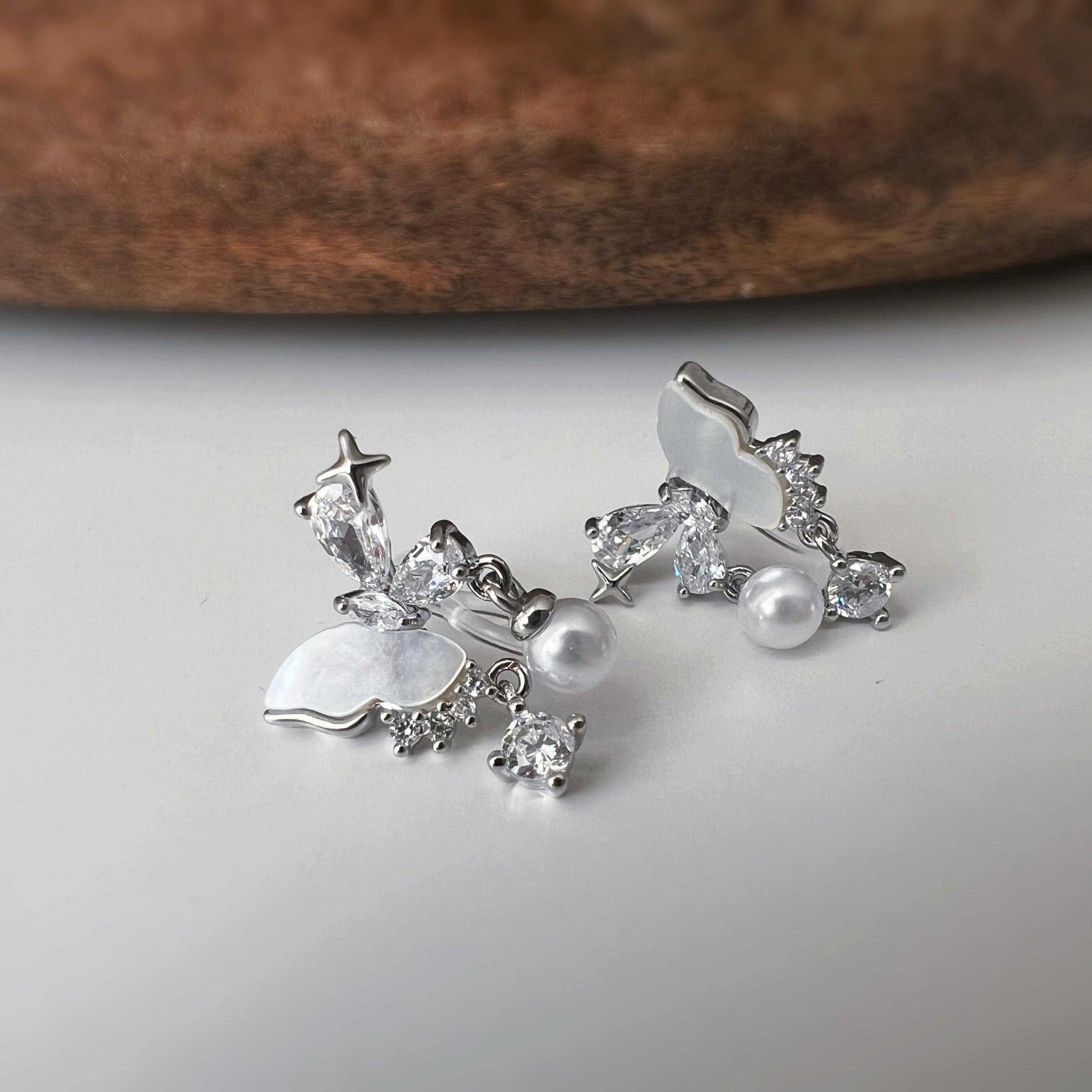 Clips d’oreilles papillon & étoiles nacrées