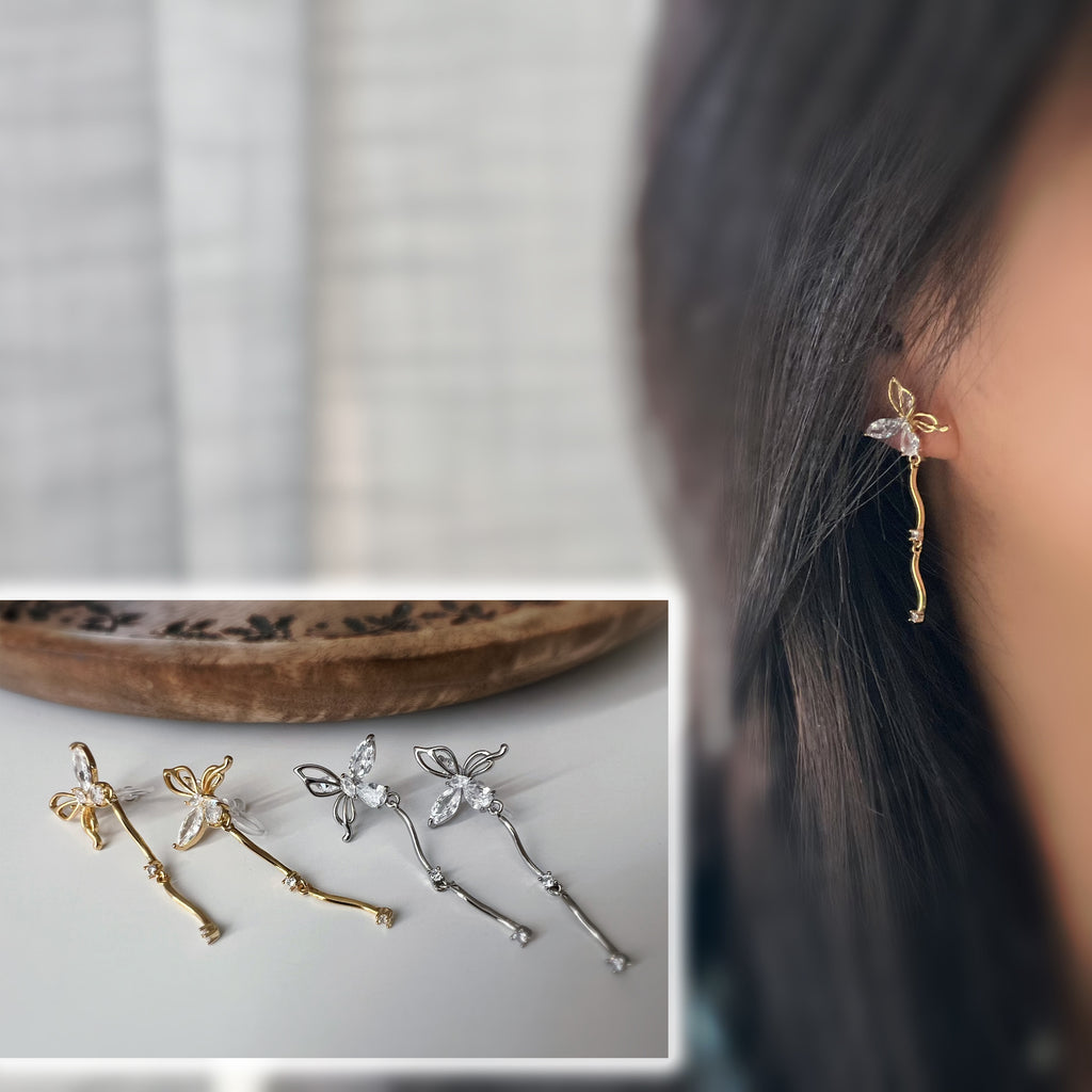 Clips d’oreilles papillon pendantes avec chaîne