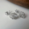 Clips d’oreilles plume scintillante – Argent / Or – Inspiration plume de phénix