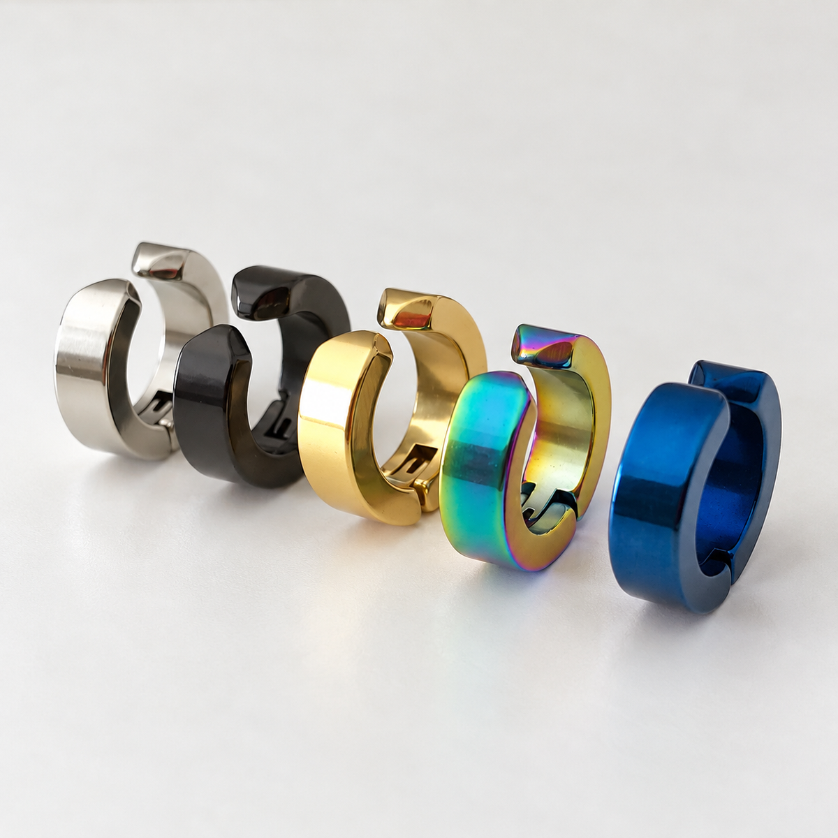 Unisex hoop clip-on earrings in silver, black, gold, and blue