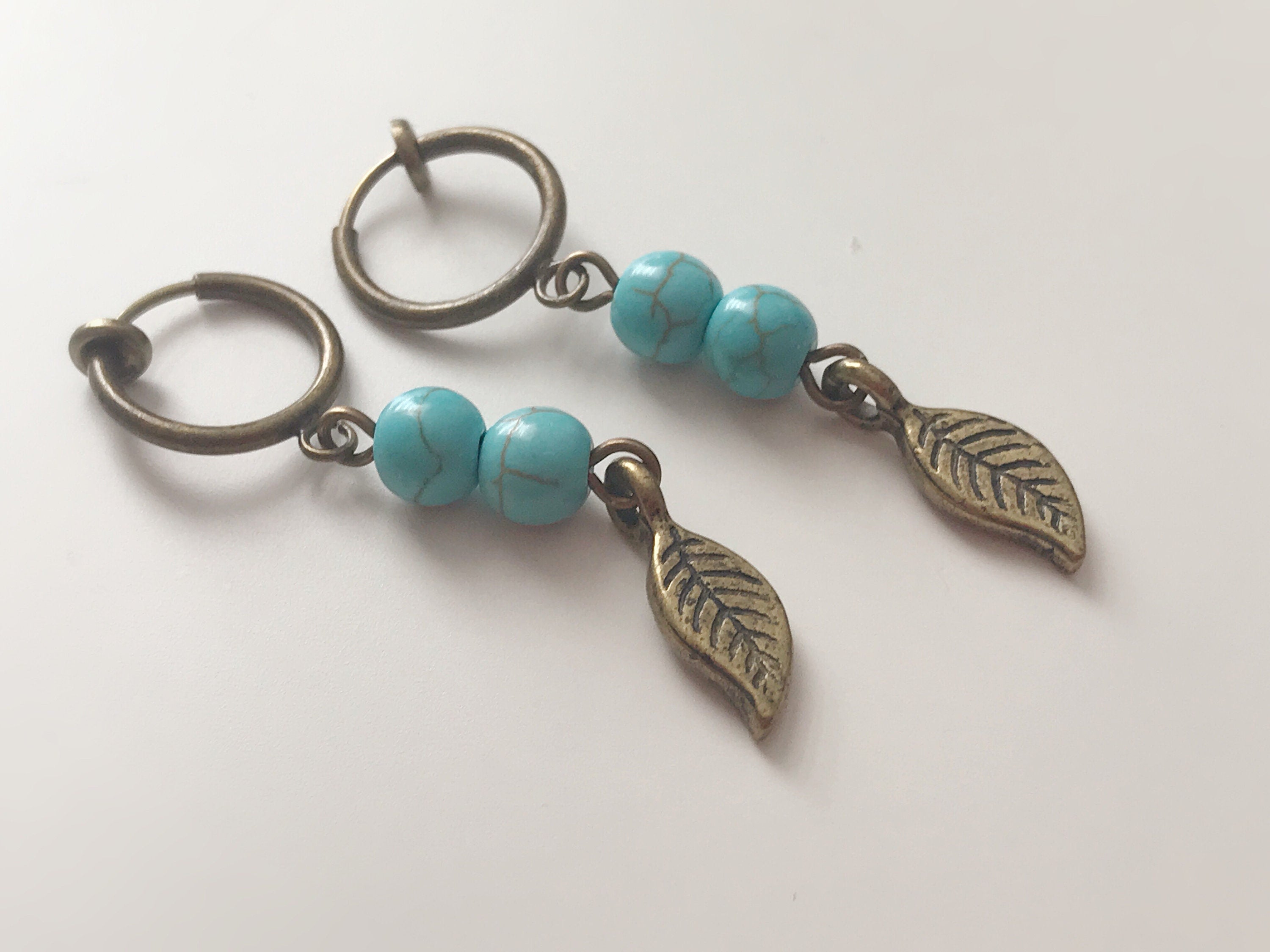 Dangling ear clips Bronze metal leaf with Small turquoise blue beads Earrings CLIPS ring, Creole, Discreet clips
