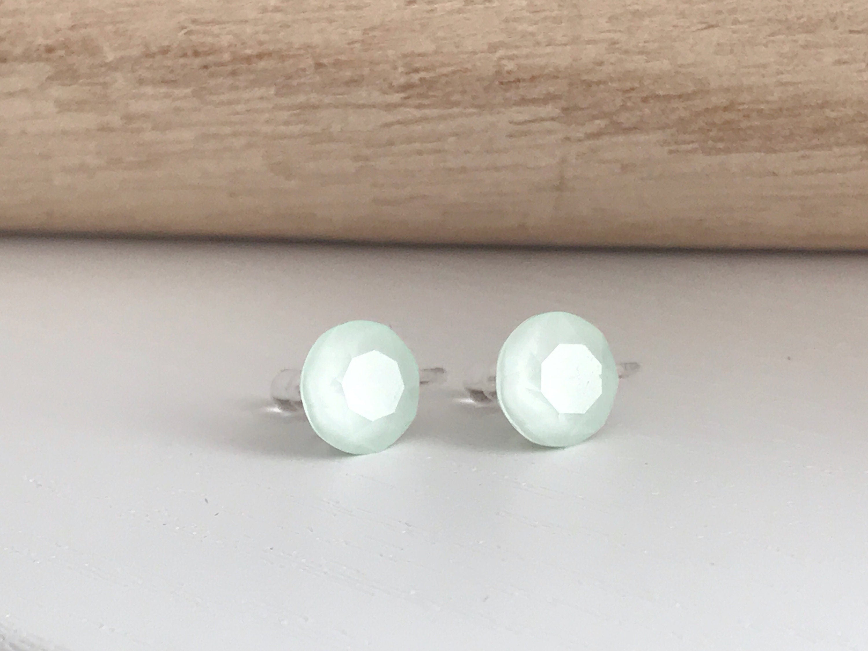 Minimalist invisible ear clips. PureCristal Crystals, Small Round Color Cream pink/ Cream green/ Cream blue/ Cream yellow. Crystal