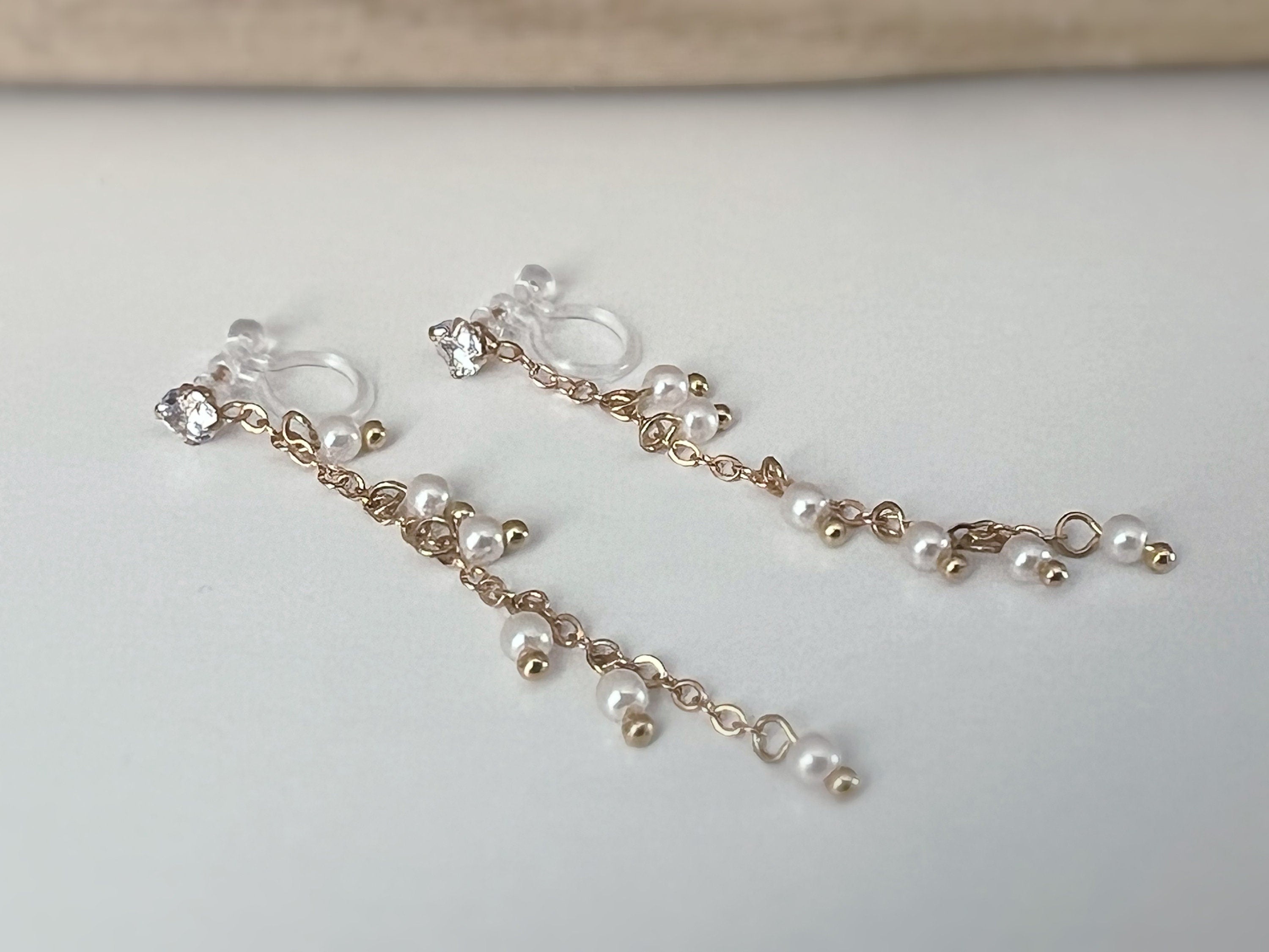 INVISIBLE clip earrings, mini zircon dangling ear clips, white pearls, gold chain. Daily jewelry for non-pierced ears