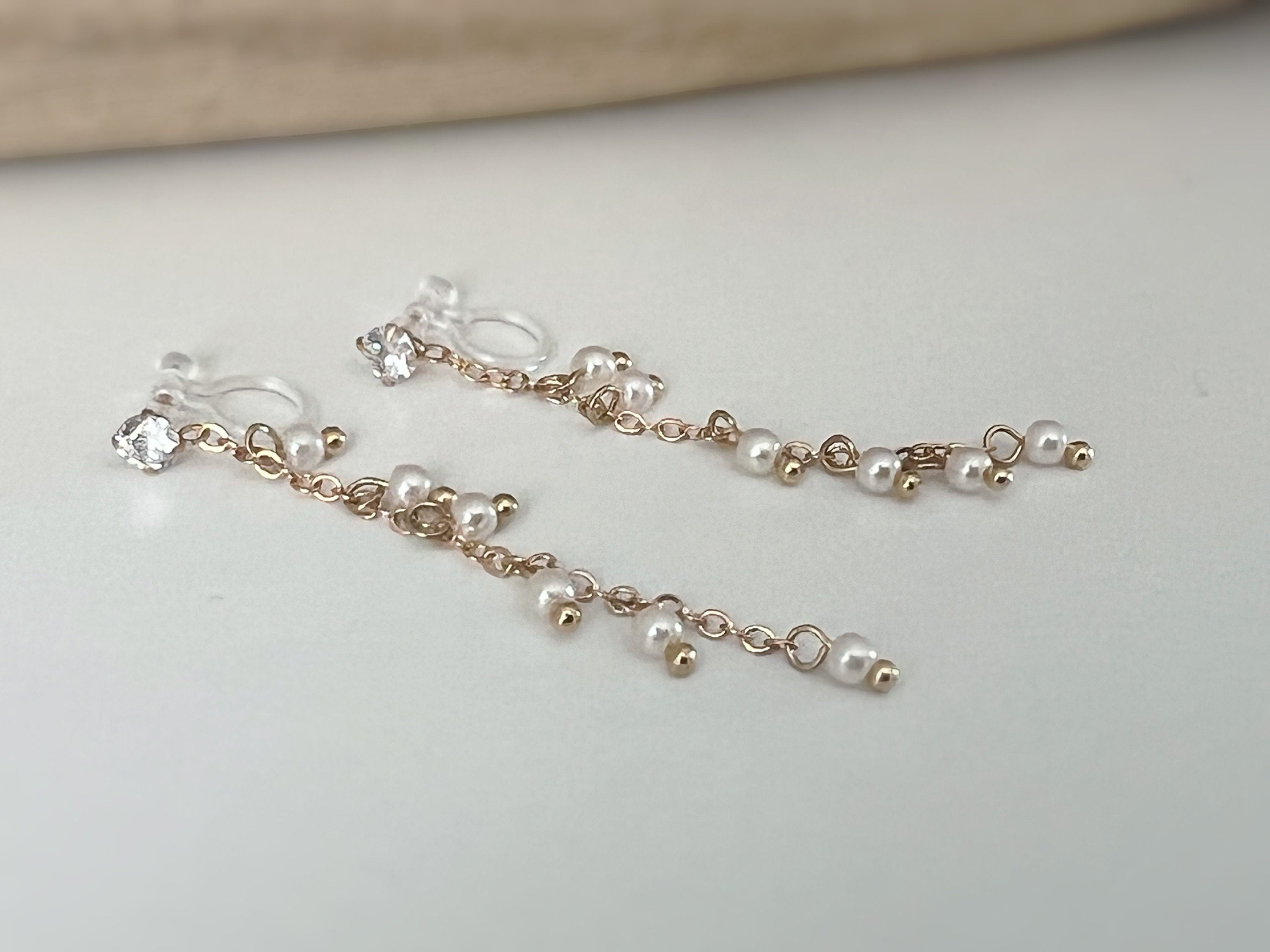 INVISIBLE clip earrings, mini zircon dangling ear clips, white pearls, gold chain. Daily jewelry for non-pierced ears