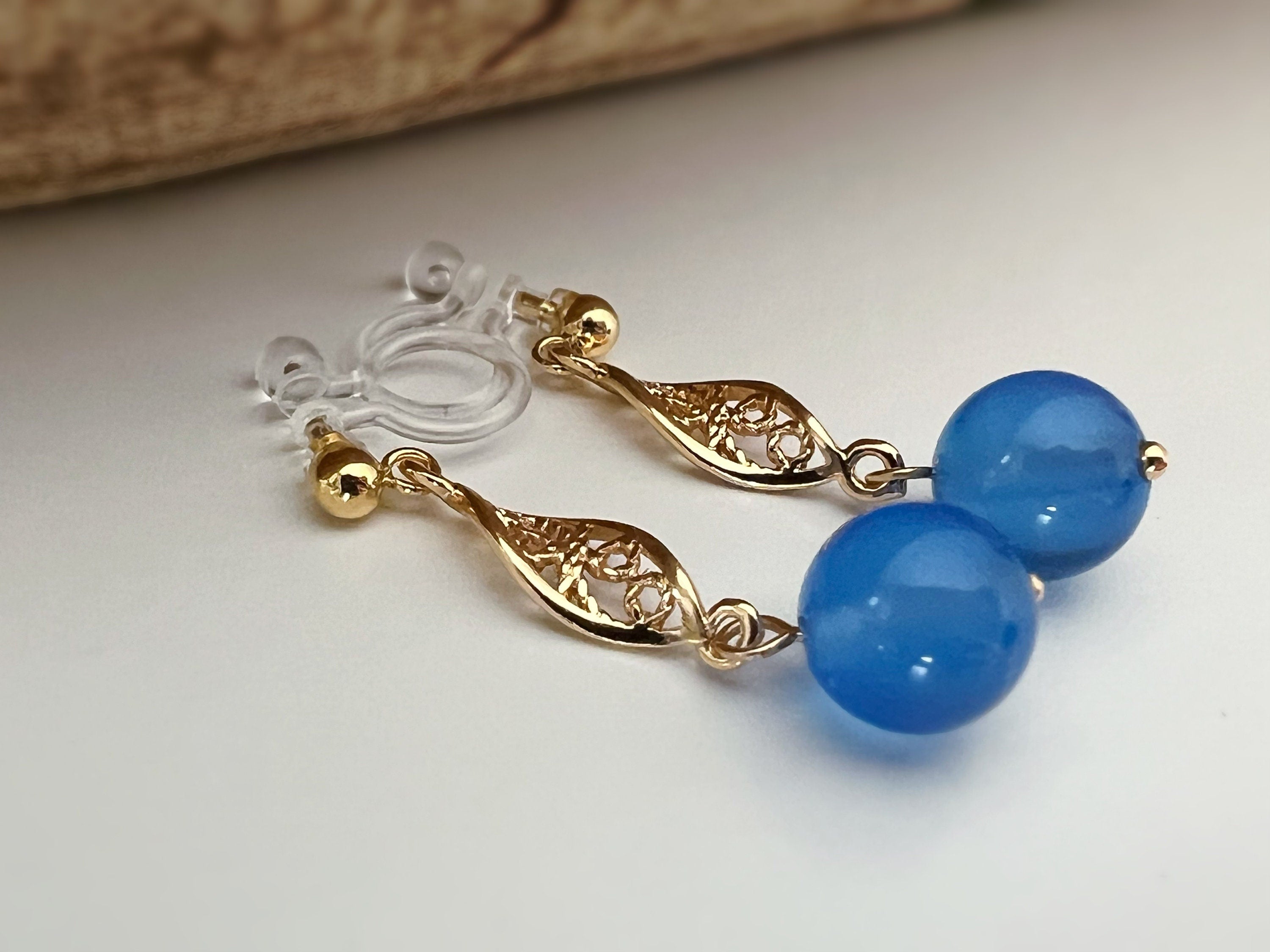 INVISIBLE Clip Earrings, Gold Ear Clips Hollow almond-shaped sculpture with blue pearl Daily jewelry. Ready to gift.