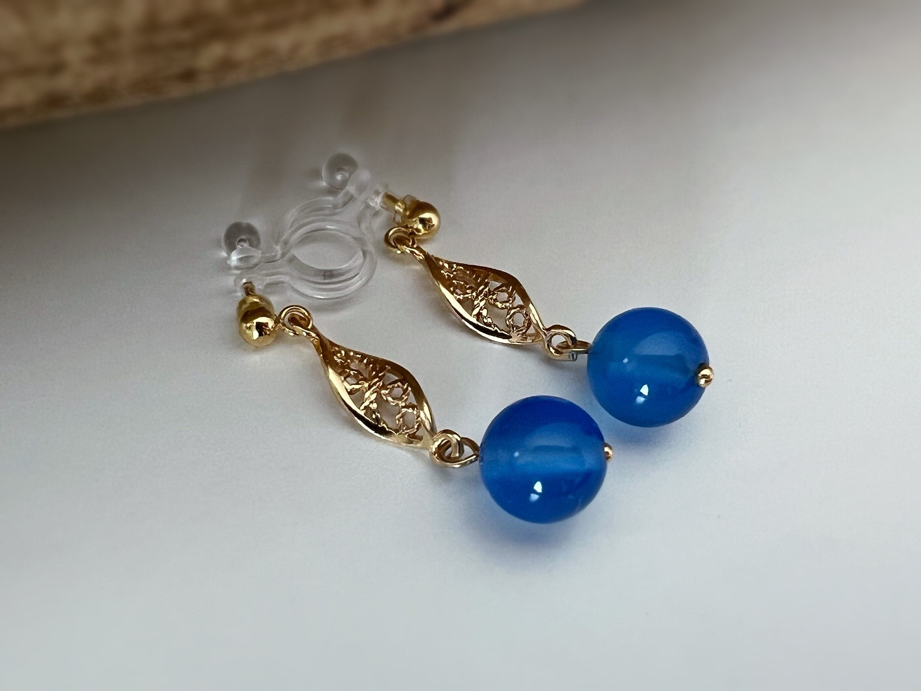 INVISIBLE Clip Earrings, Gold Ear Clips Hollow almond-shaped sculpture with blue pearl Daily jewelry. Ready to gift.
