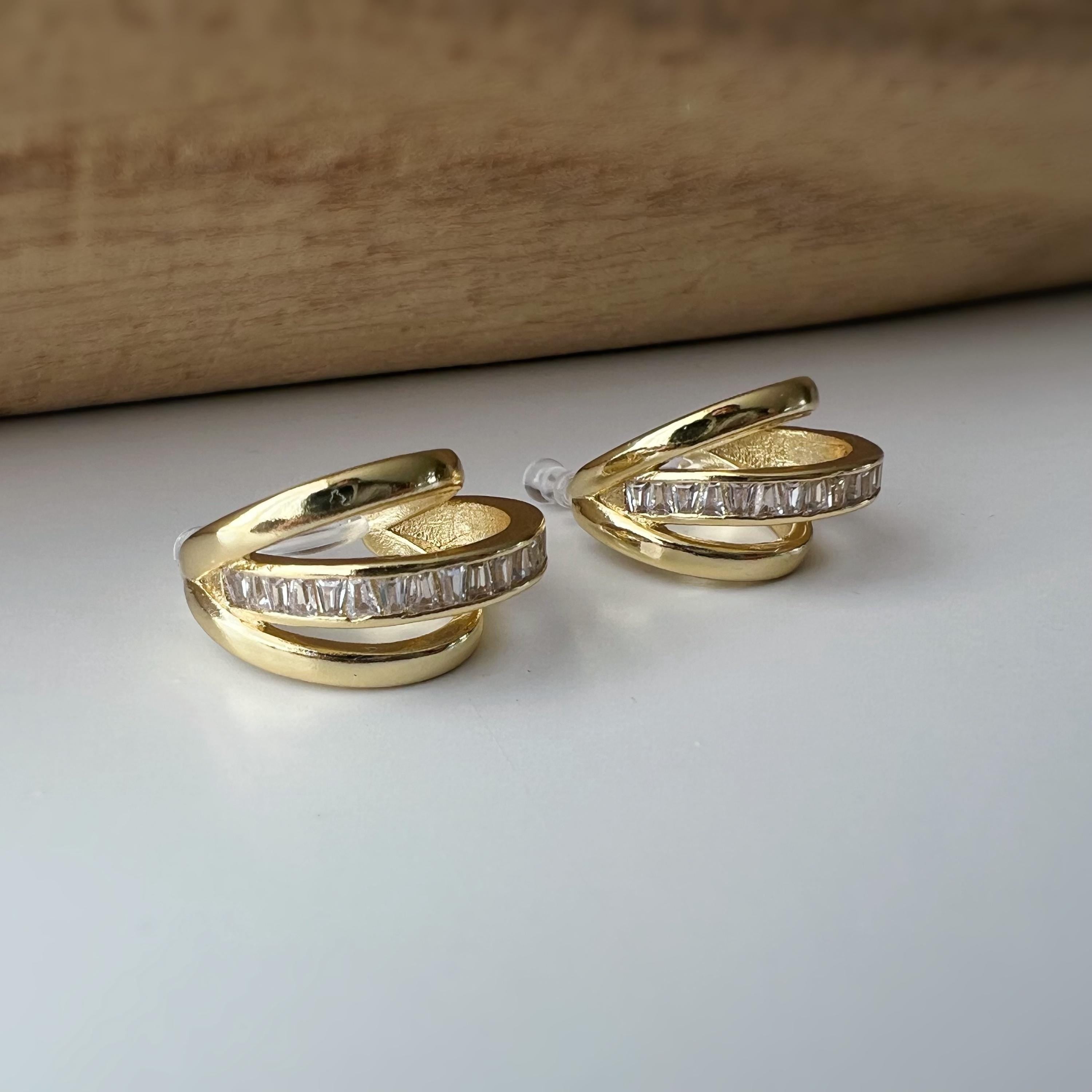 Boucles d'oreilles clip dorée triple anneau ornées strass scintillants Élégantes raffinées elles apportent une touche lumineuse sophistiquée