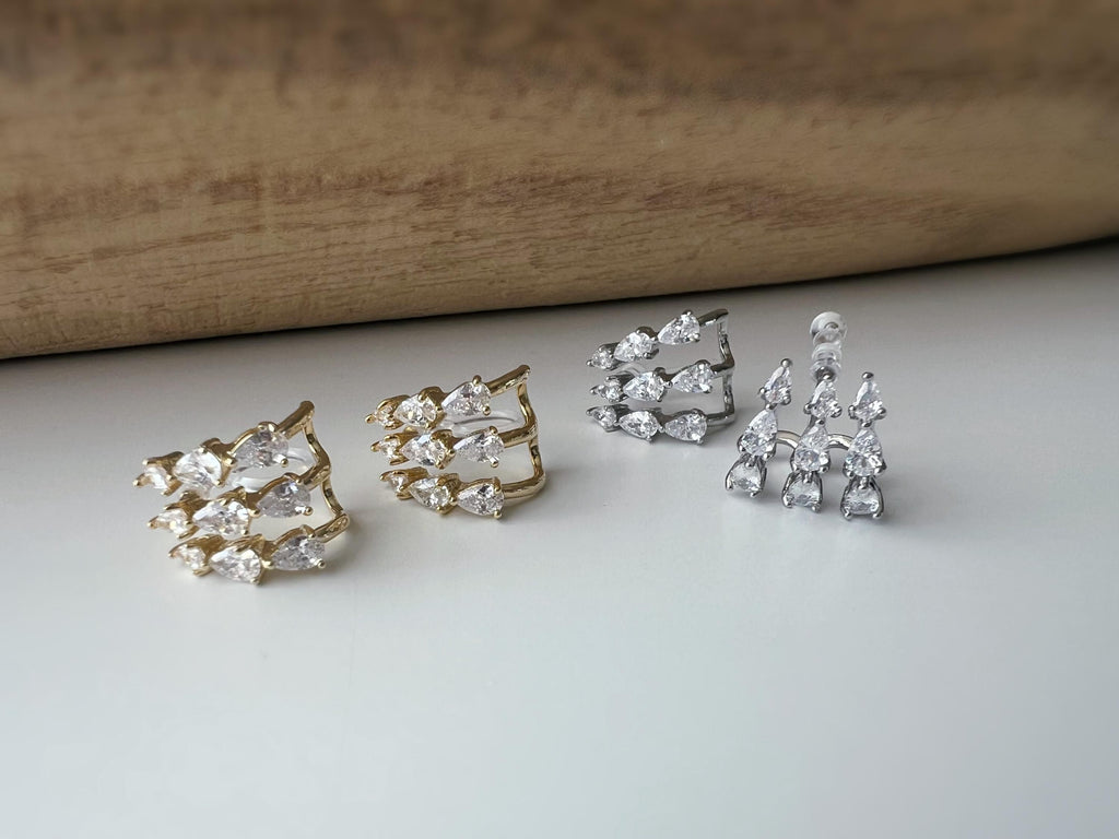Boucles d'oreilles clips élégantes en zircon en forme de gouttes Or / Argent. Un design raffiné pour une touche de glamour et d'éclat.