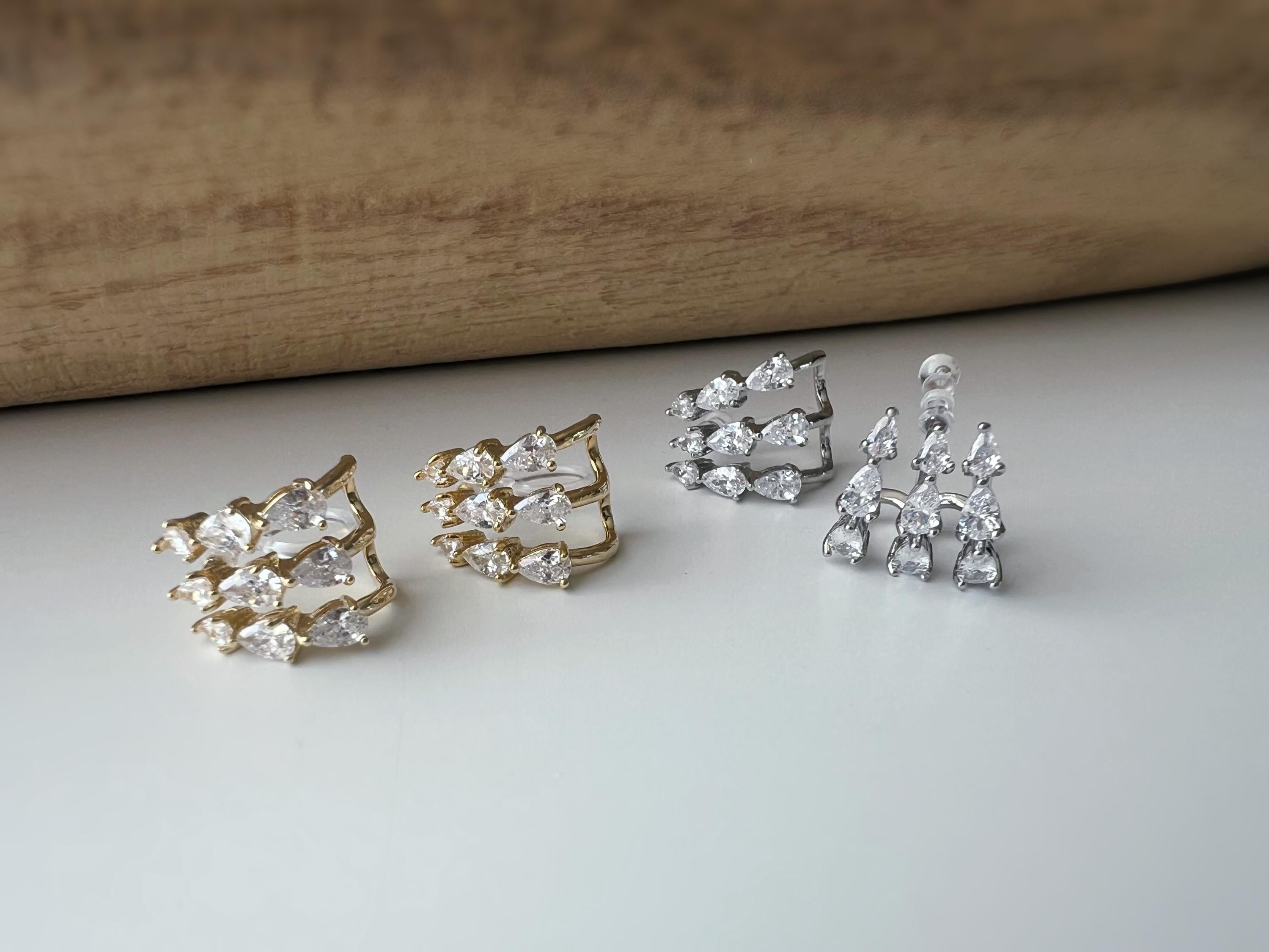 Boucles d'oreilles clips élégantes en zircon en forme de gouttes Or / Argent. Un design raffiné pour une touche de glamour et d'éclat.