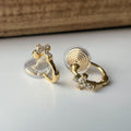 Créoles à clip minimalistes Mini croix incrustée de strass couleur or, parfaites pour un style raffiné sans perçage d’oreilles.
